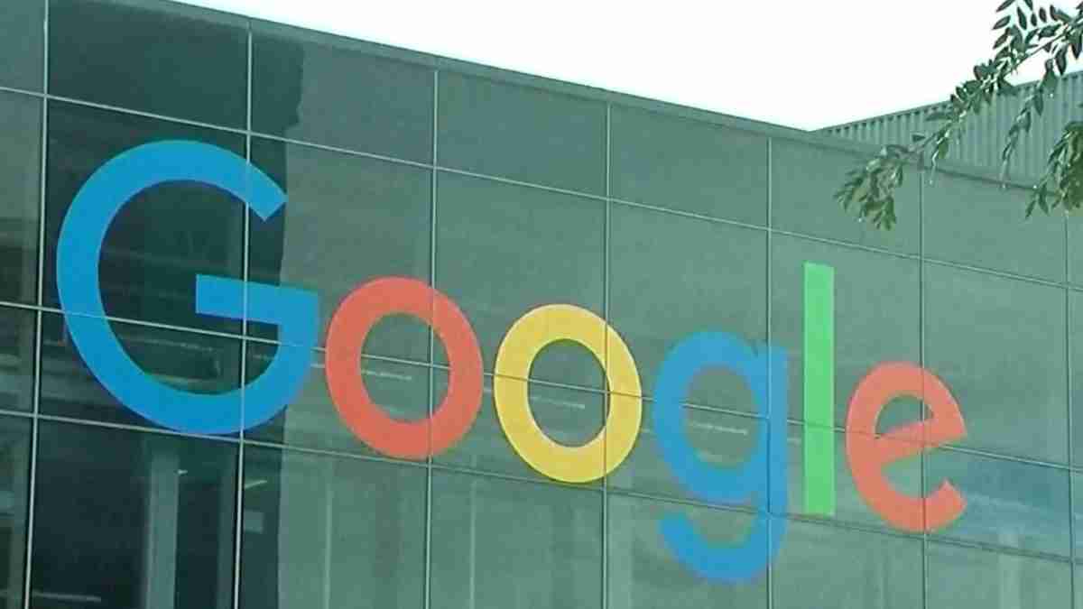 Google wordmark in blue, red, yellow and green on a glass office building facade